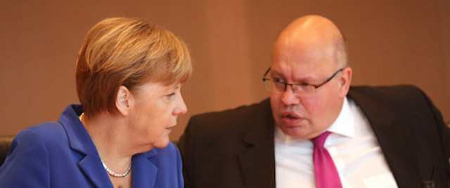 German Chancellor Angela Merkel with advisor Peter Altmaier